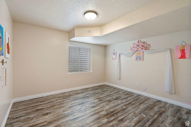 598 W Sandhill Dr, Lehi, UT 84043 - spare room featuring a textured ceiling and wood finished floors