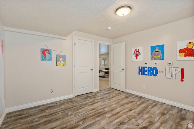 598 W Sandhill Dr, Lehi, UT 84043 - unfurnished bedroom with a textured ceiling and wood finished floors