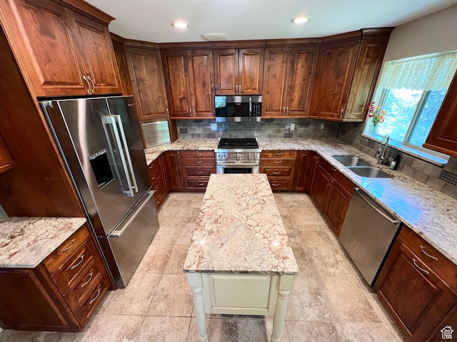 3550 E Oakview Dr, Millcreek, UT 84124 - kitchen with high end appliances, decorative backsplash, light stone countertops, recessed lighting, and light tile patterned floors