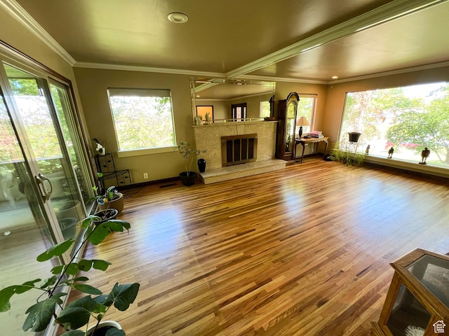 3550 E Oakview Dr, Millcreek, UT 84124 - unfurnished living room featuring wood finished floors, crown molding, and a fireplace