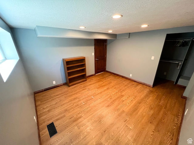 3550 E Oakview Dr, Millcreek, UT 84124 - unfurnished bedroom featuring a textured ceiling, light wood finished floors, and recessed lighting