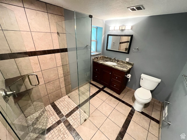 3550 E Oakview Dr, Millcreek, UT 84124 - bathroom with tile patterned floors, vanity, a shower stall, a textured ceiling, and inlaid floor details