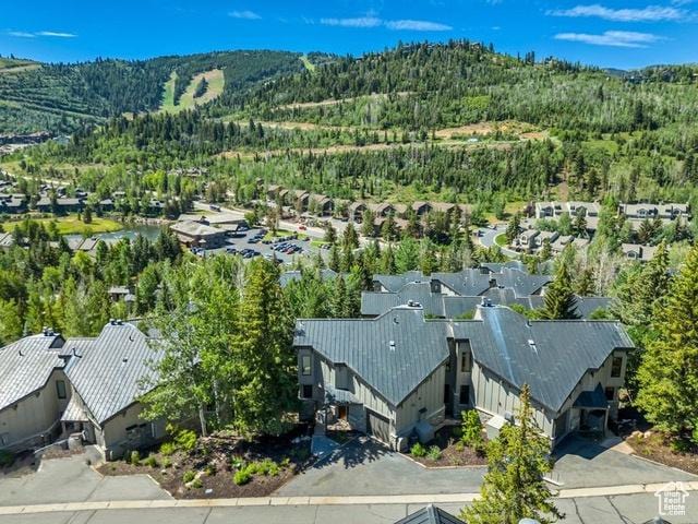 1290 Pinnacle Dr, Park City, UT 84060 - aerial view of residential area featuring a heavily wooded area and a mountain backdrop