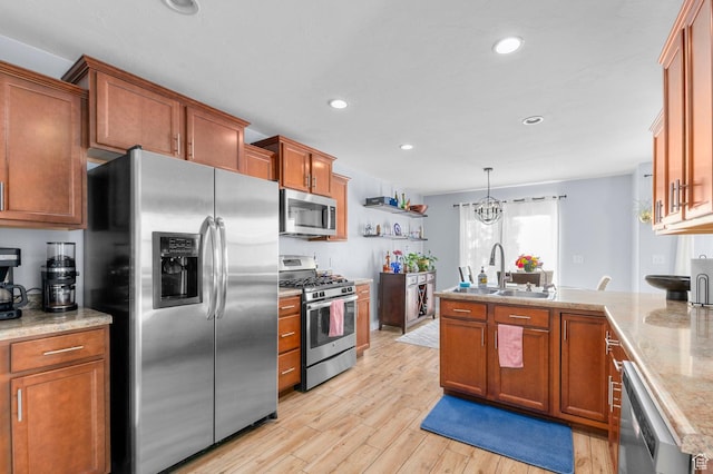 14584 S Heatherly Ln, Herriman, UT 84096 - kitchen with stainless steel appliances, a peninsula, light wood-style flooring, brown cabinets, and recessed lighting