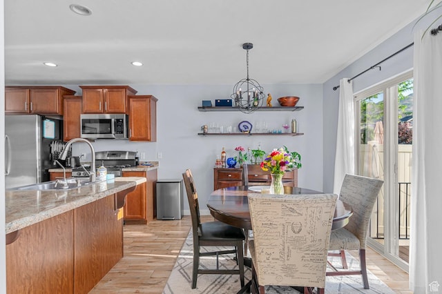 14584 S Heatherly Ln, Herriman, UT 84096 - dining room with light wood-style floors, a chandelier, and recessed lighting