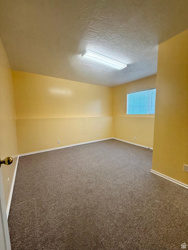 428 E 810 N, Tooele, UT 84074 - carpeted spare room featuring a textured ceiling and baseboards