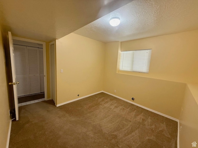 428 E 810 N, Tooele, UT 84074 - unfurnished bedroom with carpet floors, a textured ceiling, and a closet
