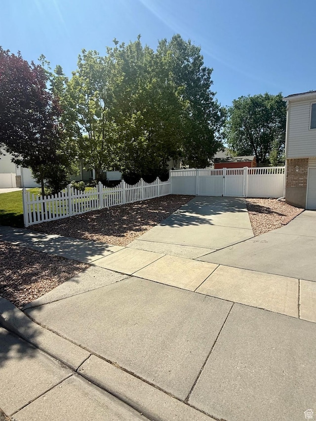 428 E 810 N, Tooele, UT 84074 - view of patio / terrace with concrete driveway, a gate, and a fenced front yard
