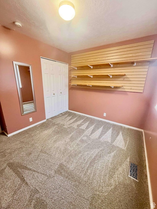 428 E 810 N, Tooele, UT 84074 - unfurnished bedroom with carpet flooring, a closet, and a textured ceiling