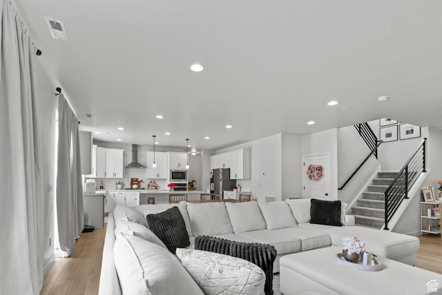 2488 W 2940 S, Syracuse, UT 84075 - living room with light wood-style floors, recessed lighting, and stairs