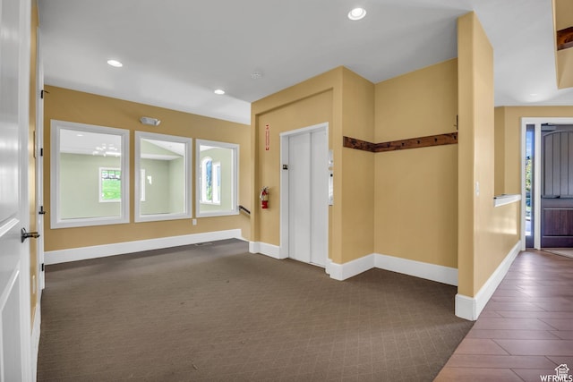 10865 S Hiddenwood Dr, Sandy, UT 84092 - entryway with dark colored carpet, recessed lighting, and elevator