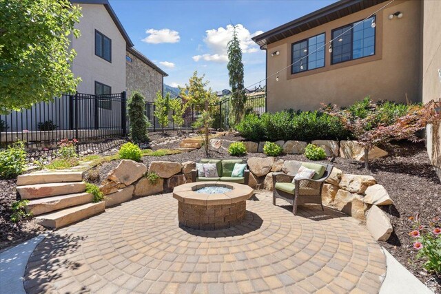10865 S Hiddenwood Dr, Sandy, UT 84092 - view of patio with an outdoor fire pit