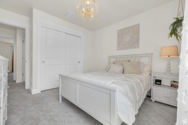 10865 S Hiddenwood Dr, Sandy, UT 84092 - bedroom featuring a chandelier, a closet, and light colored carpet