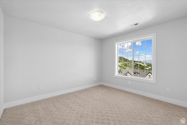 10865 S Hiddenwood Dr, Sandy, UT 84092 - carpeted empty room with baseboards and a textured ceiling