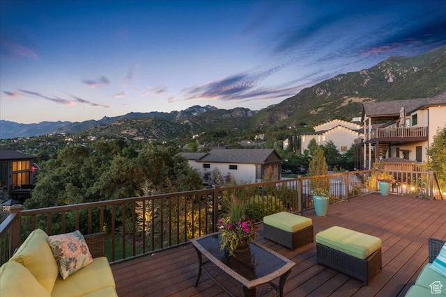 10865 S Hiddenwood Dr, Sandy, UT 84092 - deck at dusk with a mountain view and an outdoor hangout area