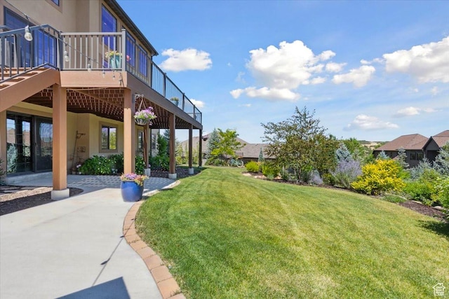 10865 S Hiddenwood Dr, Sandy, UT 84092 - view of green lawn with a wooden deck and a patio