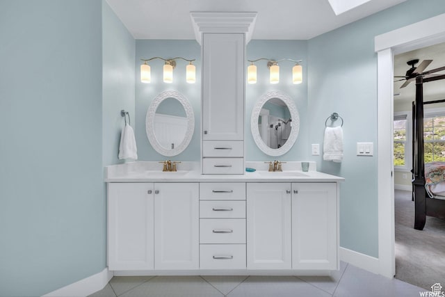 10865 S Hiddenwood Dr, Sandy, UT 84092 - full bathroom with double vanity, ceiling fan, tile patterned flooring, and a skylight