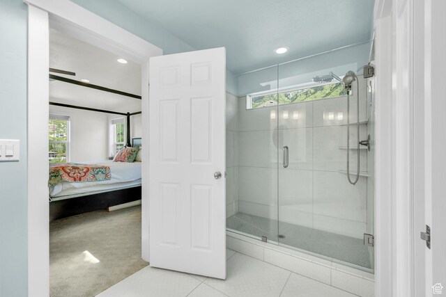10865 S Hiddenwood Dr, Sandy, UT 84092 - bathroom featuring connected bathroom, healthy amount of natural light, a shower stall, tile patterned flooring, and recessed lighting