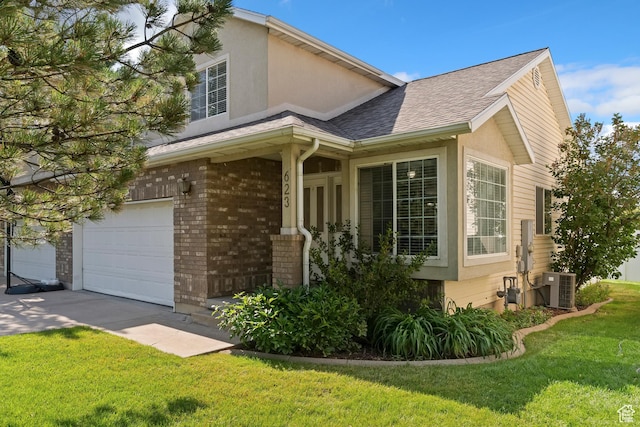 623 W 550 S, Centerville, UT 84014 - view of front of property with a front lawn, brick siding, an attached garage, a shingled roof, and stucco siding
