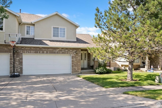 623 W 550 S, Centerville, UT 84014 - view of front facade featuring concrete driveway, an attached garage, brick siding, a front yard, and roof with shingles
