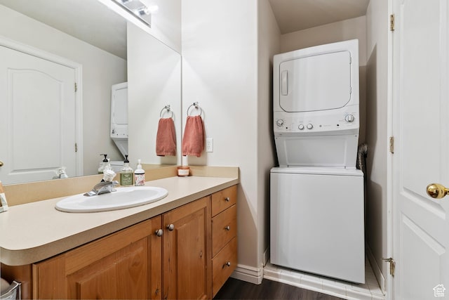 623 W 550 S, Centerville, UT 84014 - bathroom with estacked washer and dryer, vanity, and wood finished floors
