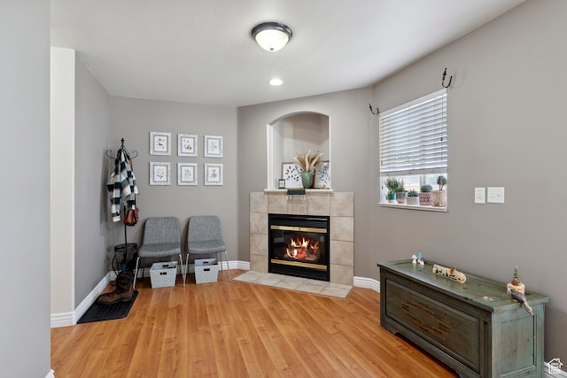 623 W 550 S, Centerville, UT 84014 - sitting room with a tiled fireplace and light wood finished floors