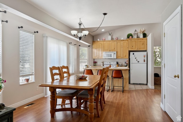 623 W 550 S, Centerville, UT 84014 - dining space featuring a chandelier, light wood-style flooring, and lofted ceiling