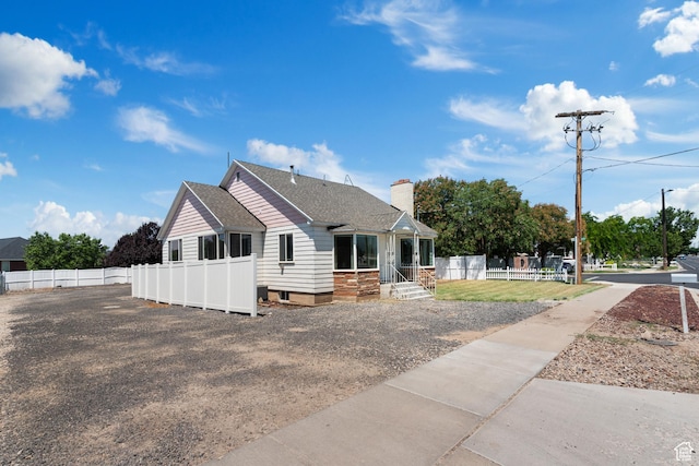 2536 S 1000 W, Syracuse, UT 84075 - view of front of house featuring a chimney and a shingled roof