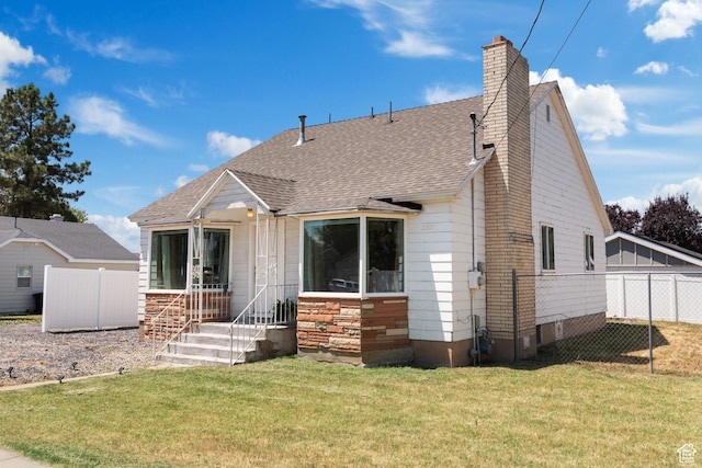 2536 S 1000 W, Syracuse, UT 84075 - rear view of property with roof with shingles and a chimney