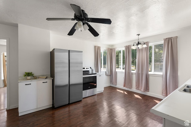 2536 S 1000 W, Syracuse, UT 84075 - kitchen with appliances with stainless steel finishes, light countertops, dark wood-type flooring, a chandelier, and a textured ceiling