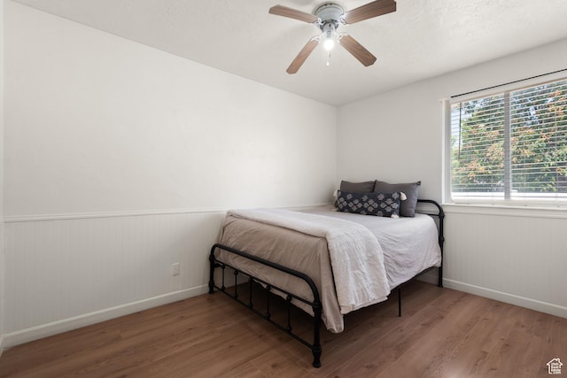 2536 S 1000 W, Syracuse, UT 84075 - bedroom featuring wood finished floors, wainscoting, and ceiling fan