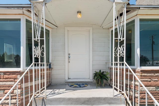 2536 S 1000 W, Syracuse, UT 84075 - doorway to property featuring a porch