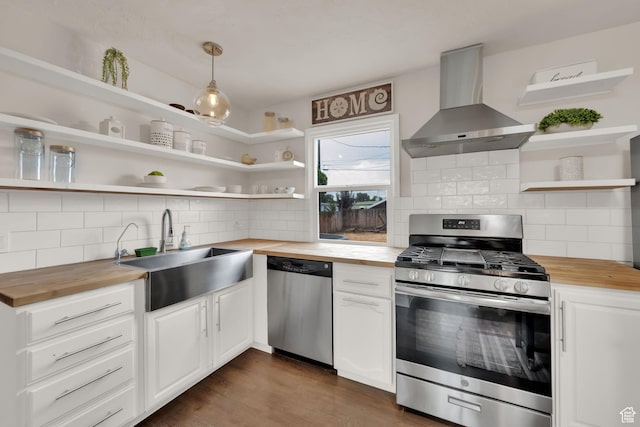 1730 W 150 N, Provo, UT 84601 - kitchen with butcher block countertops, wall chimney range hood, open shelves, stainless steel appliances, and tasteful backsplash