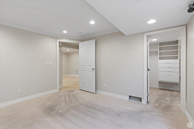 1116 W Wasatch Downs Dr, South Jordan, UT 84095 - unfurnished bedroom with recessed lighting, light colored carpet, a walk in closet, and crown molding