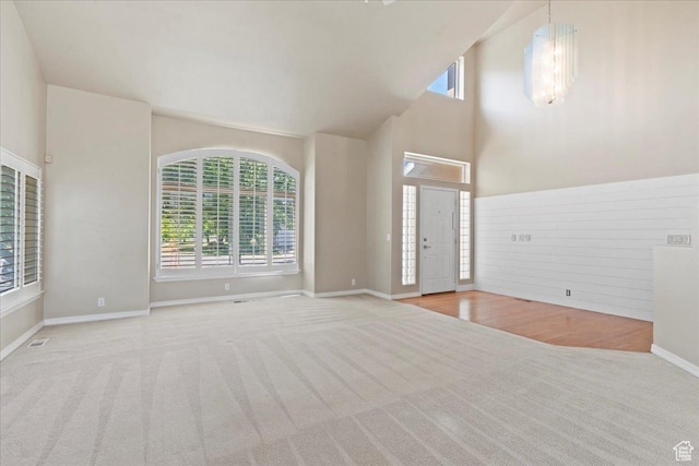 1116 W Wasatch Downs Dr, South Jordan, UT 84095 - unfurnished living room with carpet and high vaulted ceiling