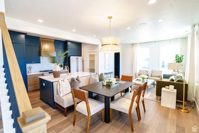 11448 S Watercourse Rd, South Jordan, UT 84009 - dining area featuring light wood-type flooring and recessed lighting