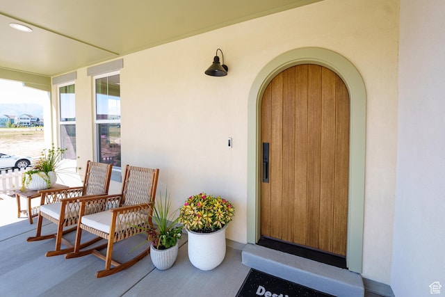 11448 S Watercourse Rd, South Jordan, UT 84009 - view of exterior entry featuring a porch and stucco siding