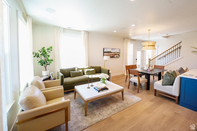 11448 S Watercourse Rd, South Jordan, UT 84009 - living room featuring light wood finished floors, plenty of natural light, and recessed lighting