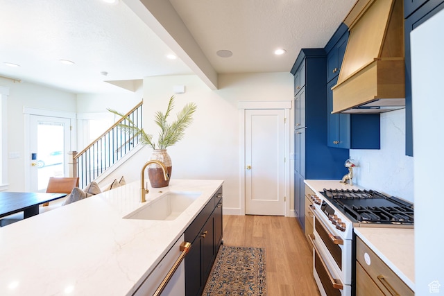 11448 S Watercourse Rd, South Jordan, UT 84009 - kitchen featuring white appliances, custom exhaust hood, light wood-type flooring, light stone counters, and recessed lighting