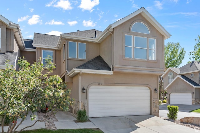 3548 E Wasatch Hills Ln S, Cottonwood Heights, UT 84121 - view of front of house with stucco siding, an attached garage, and a shingled roof
