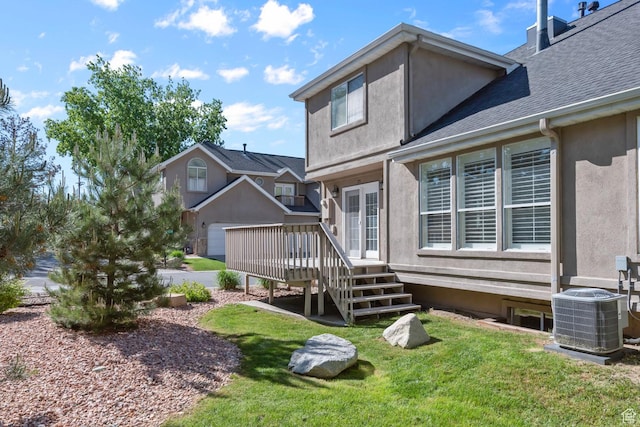 3548 E Wasatch Hills Ln S, Cottonwood Heights, UT 84121 - rear view of house with a deck, stucco siding, a yard, and roof with shingles