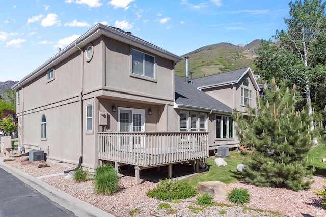 3548 E Wasatch Hills Ln S, Cottonwood Heights, UT 84121 - back of house with a deck with mountain view and stucco siding