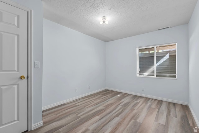 3548 E Wasatch Hills Ln S, Cottonwood Heights, UT 84121 - empty room featuring wood finished floors and a textured ceiling