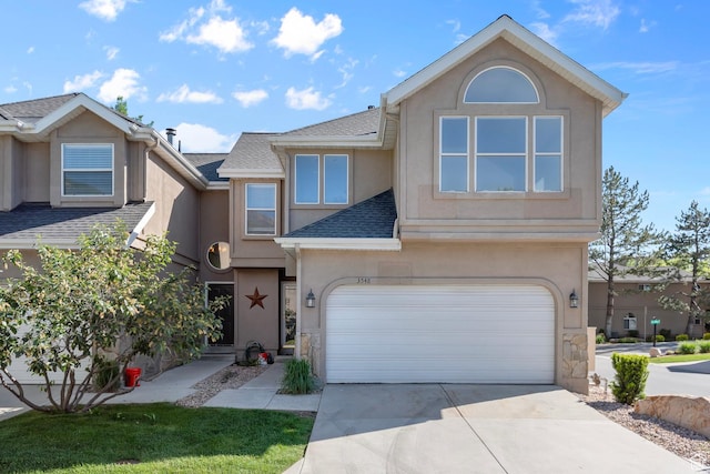 3548 E Wasatch Hills Ln S, Cottonwood Heights, UT 84121 - view of front of property featuring stucco siding, a garage, roof with shingles, and concrete driveway