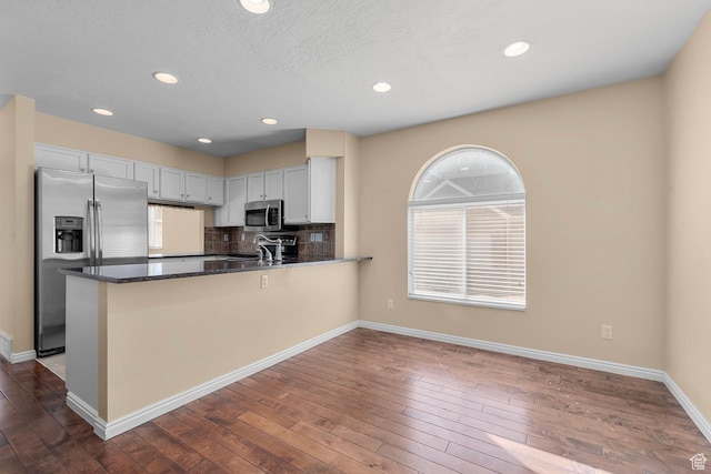 3548 E Wasatch Hills Ln S, Cottonwood Heights, UT 84121 - kitchen featuring stainless steel appliances, healthy amount of natural light, dark wood-style floors, and recessed lighting