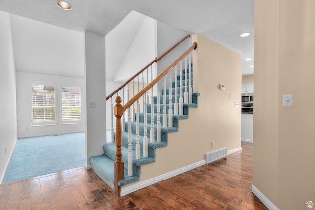 3548 E Wasatch Hills Ln S, Cottonwood Heights, UT 84121 - staircase with hardwood / wood-style flooring and recessed lighting