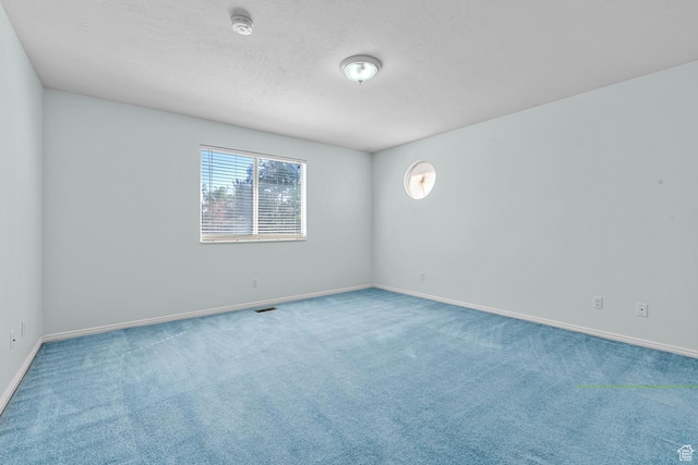 3548 E Wasatch Hills Ln S, Cottonwood Heights, UT 84121 - empty room featuring carpet flooring, a smoke detector, and a textured ceiling