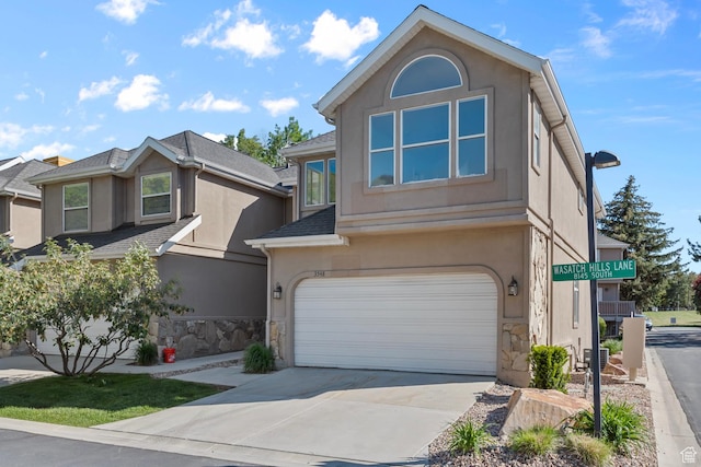 3548 E Wasatch Hills Ln S, Cottonwood Heights, UT 84121 - traditional-style home with stucco siding, stone siding, a garage, and driveway