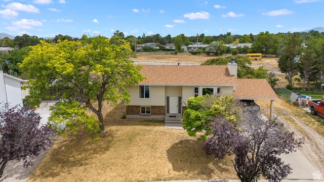 4323 W Benview Dr, West Valley City, UT 84120 - view of front of house with a chimney, driveway, and brick siding