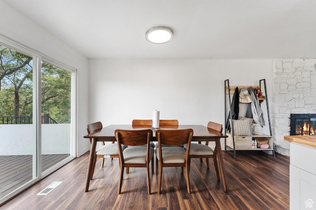 4323 W Benview Dr, West Valley City, UT 84120 - dining area featuring dark wood-type flooring and a fireplace